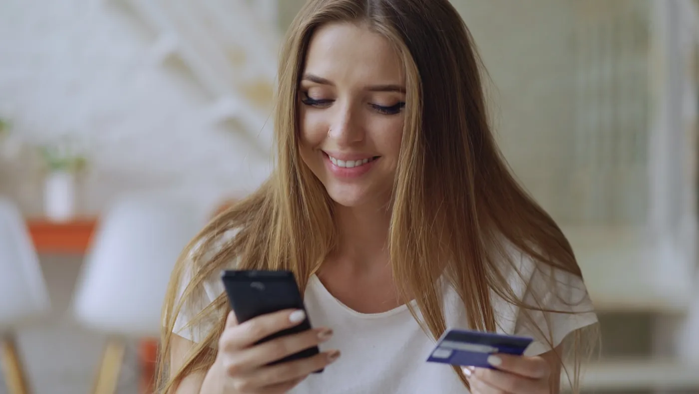 A person completing a mobile payment with a card